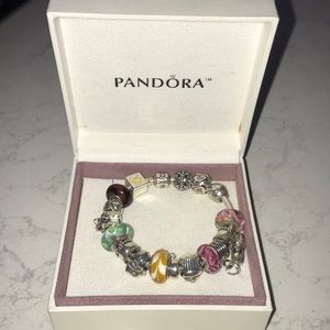 Pandora bracelet with 17 charms (2 are spacers)